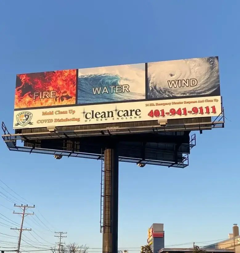 Clean Care of New England's own roadside billboard with fire, water and wind panels and a Certified Disaster Restoration badge