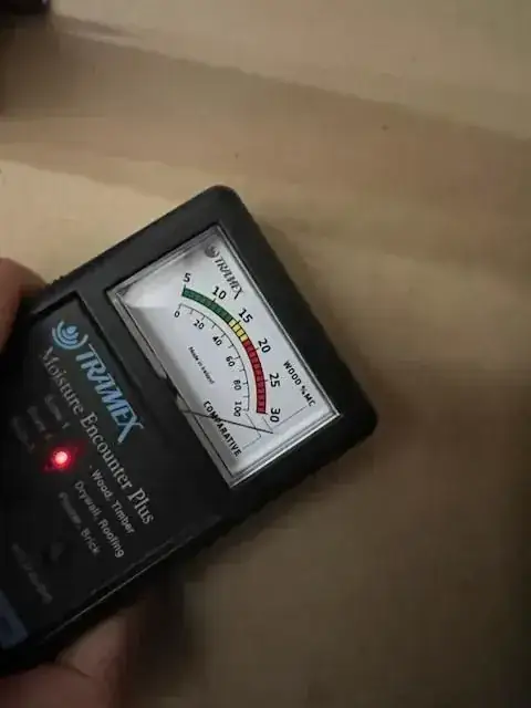 Close up of a Tramex moisture meter mid reading